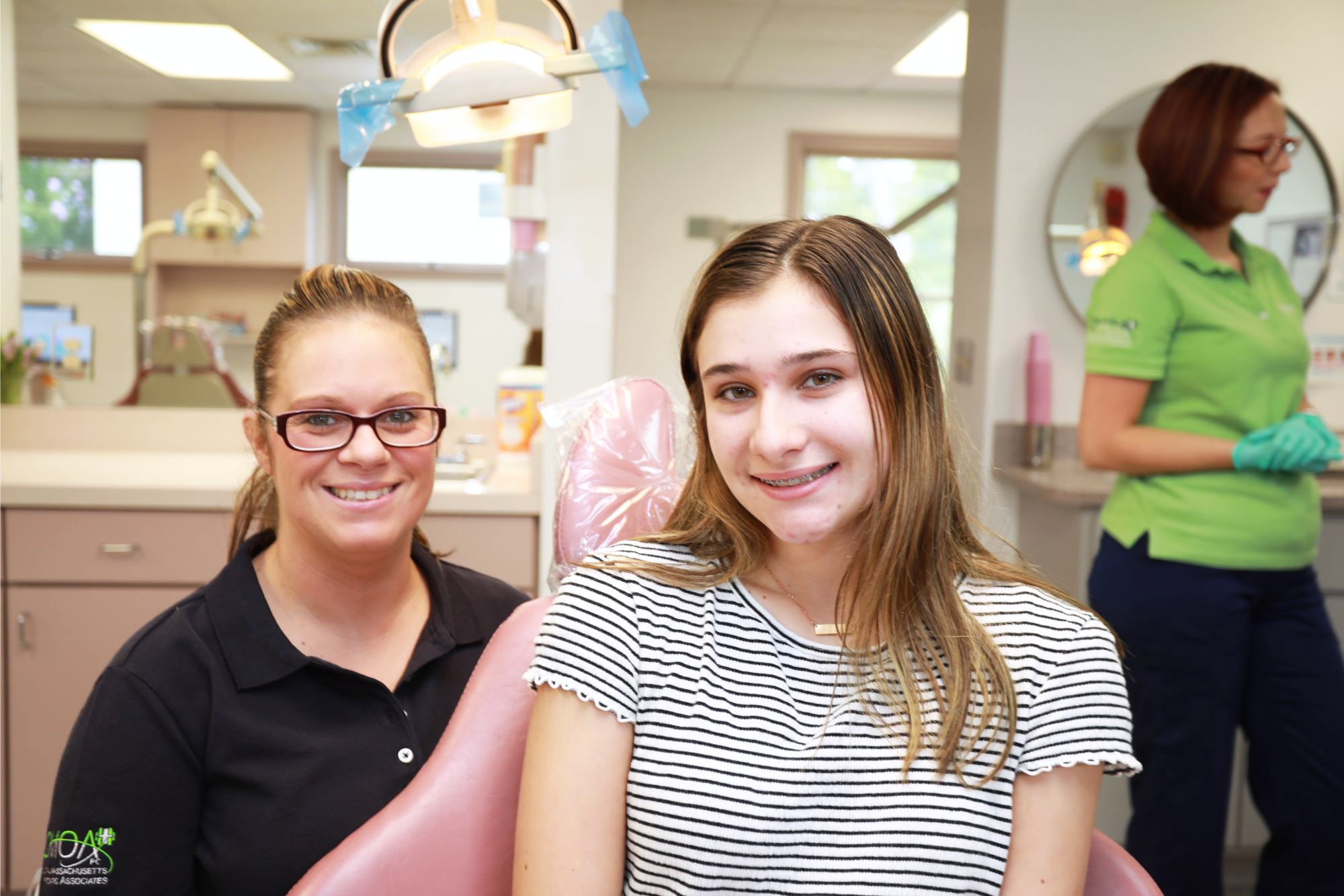 team member and patient smiling