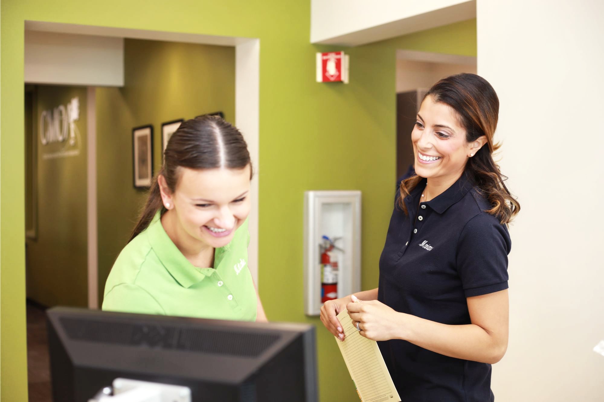 team member and patient smiling